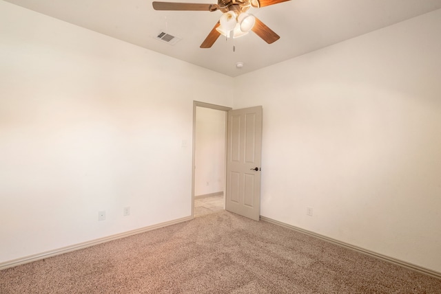 carpeted empty room with ceiling fan