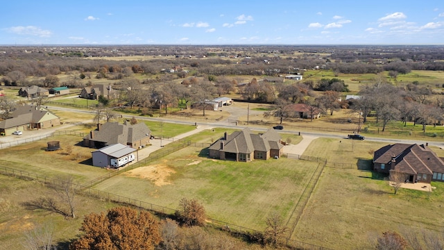 birds eye view of property with a rural view