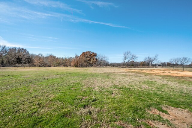 124 Mill Crossing Ln, Springtown, TX 76082 - unfurnished living room featuring arched walkways, hardwood / wood-style floors, visible vents, and ceiling fan