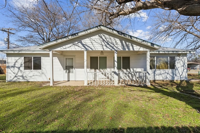 view of front of house with a porch and a front lawn