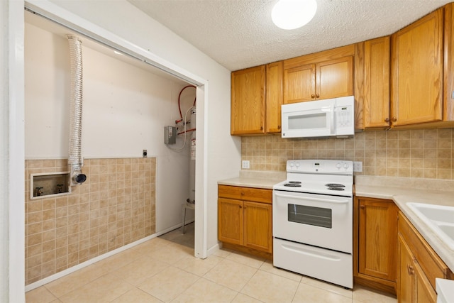 kitchen with a textured ceiling, tasteful backsplash, and white appliances