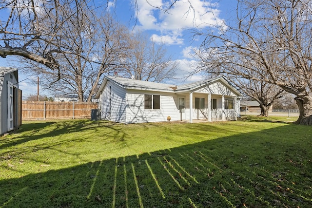 rear view of house with a lawn