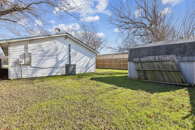 view of yard featuring a storage unit and cooling unit