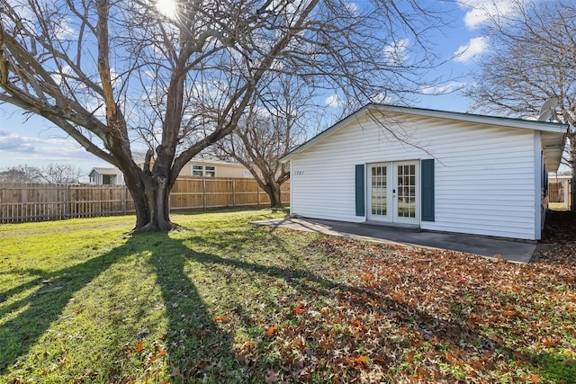 view of yard featuring french doors and a patio area