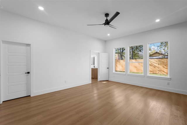 unfurnished bedroom featuring hardwood / wood-style flooring and ceiling fan