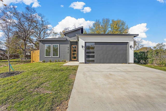 modern home with a front lawn and a garage