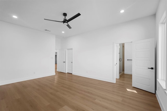 interior space with ceiling fan and light hardwood / wood-style flooring