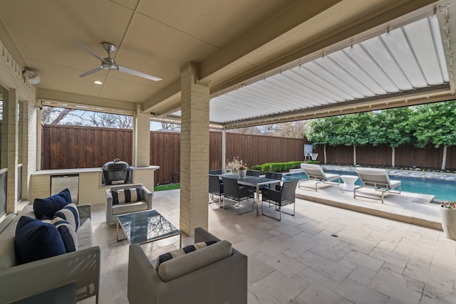 view of patio featuring ceiling fan, a fenced in pool, an outdoor living space, and grilling area