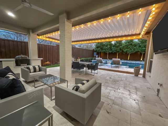 view of patio / terrace with outdoor lounge area, grilling area, a fenced in pool, and ceiling fan