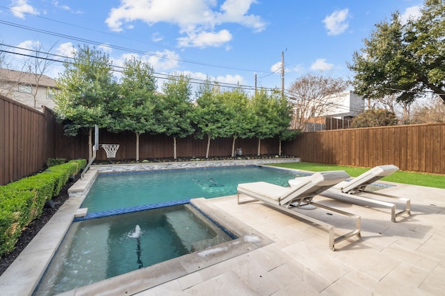 view of swimming pool with an in ground hot tub and a patio