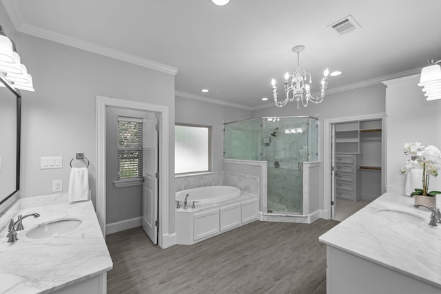 bathroom featuring vanity, separate shower and tub, crown molding, and a chandelier