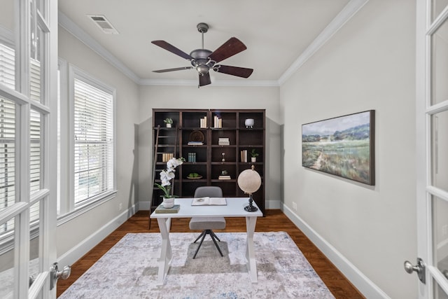 office space featuring crown molding, french doors, ceiling fan, and dark wood-type flooring