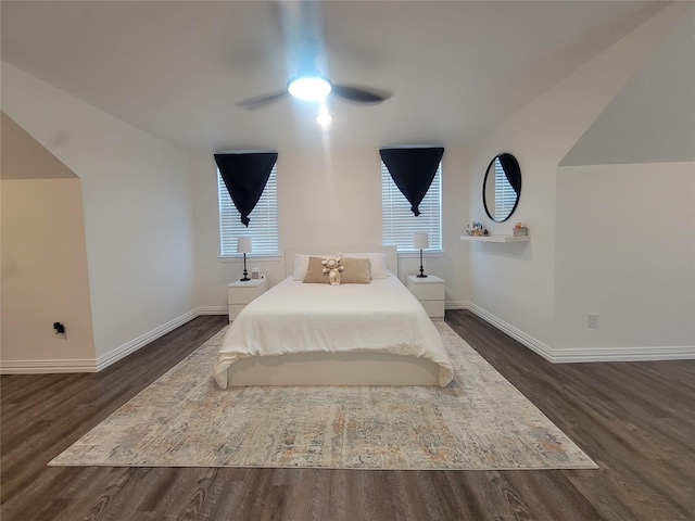 bedroom with multiple windows, dark hardwood / wood-style floors, and ceiling fan