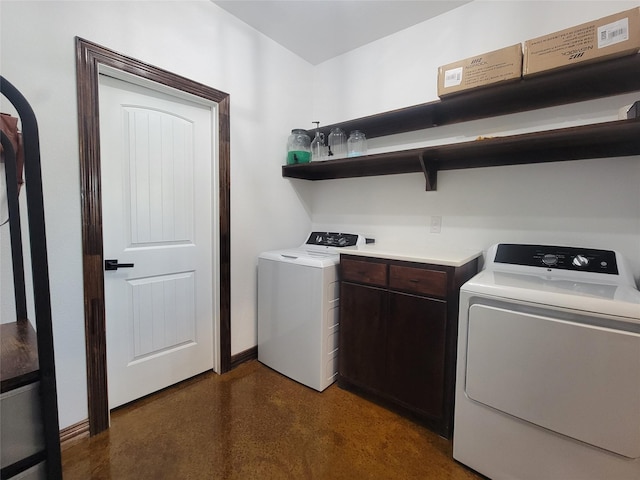 laundry area featuring cabinets and washing machine and clothes dryer