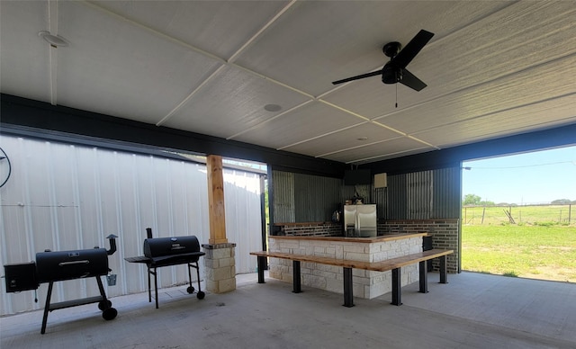 view of patio featuring a grill and ceiling fan