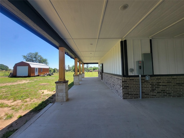 view of patio / terrace featuring a garage and an outdoor structure