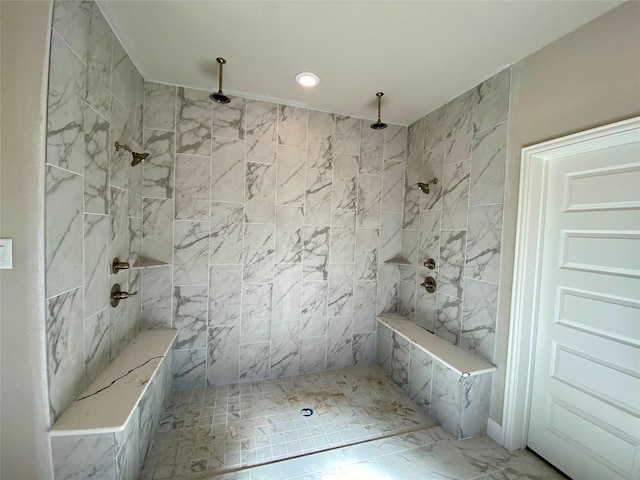 bathroom featuring tiled shower