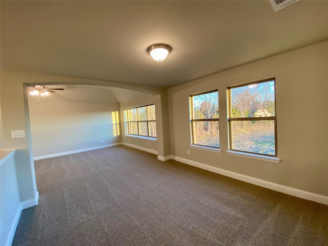 carpeted empty room featuring ceiling fan