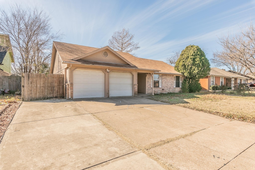 single story home featuring a garage