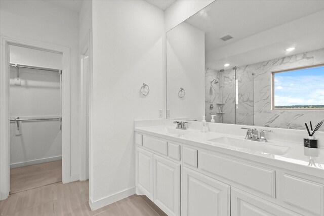 bathroom with vanity and an enclosed shower