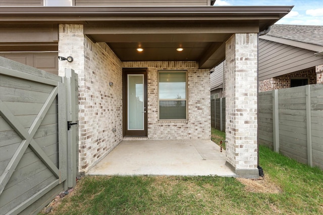 entrance to property featuring a patio