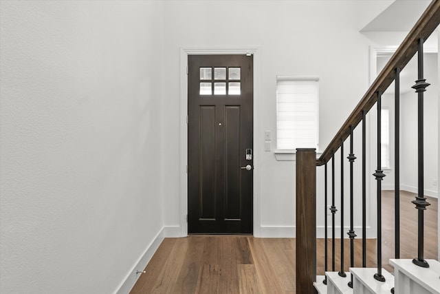 entrance foyer featuring hardwood / wood-style floors