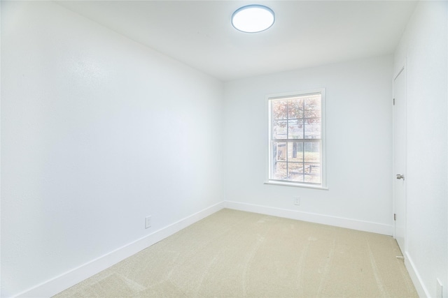 empty room featuring light carpet