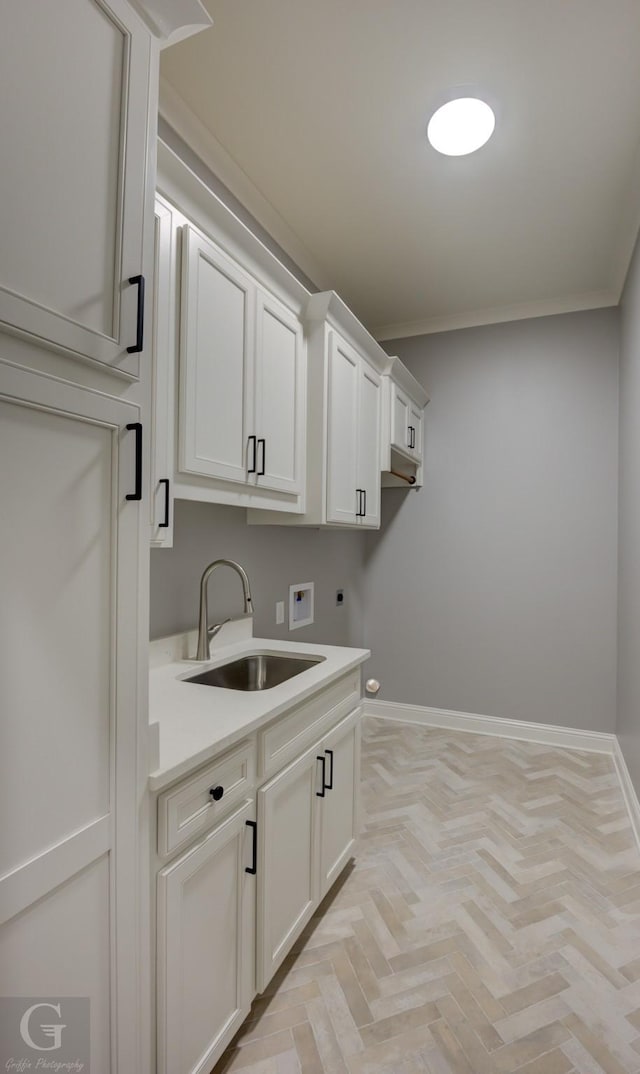 laundry room featuring hookup for an electric dryer, washer hookup, cabinets, light parquet floors, and sink