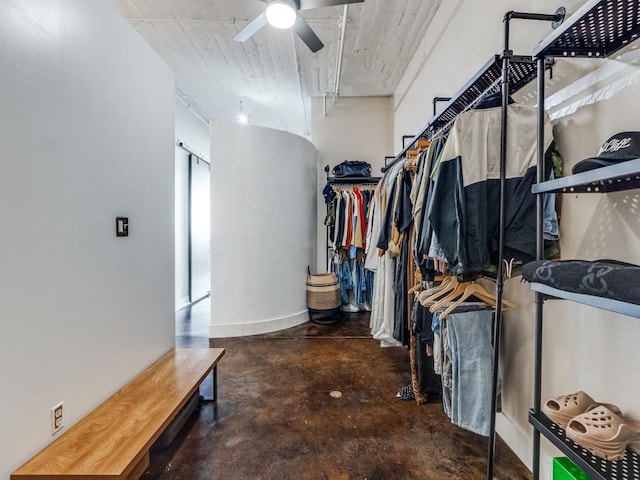 spacious closet with ceiling fan