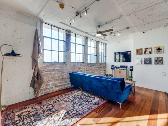 living room featuring ceiling fan, wood-type flooring, and track lighting