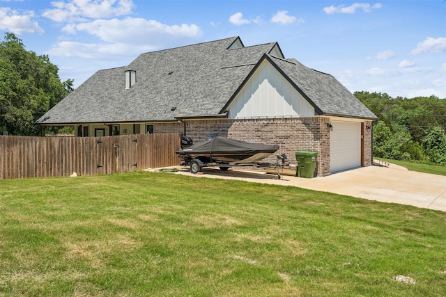 view of front of house with a garage and a front lawn