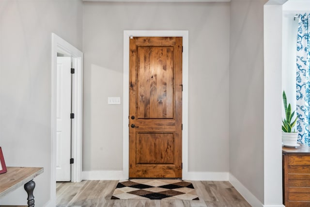 entryway with light hardwood / wood-style flooring