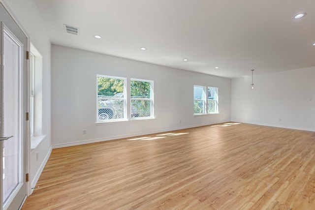 spare room featuring light hardwood / wood-style flooring