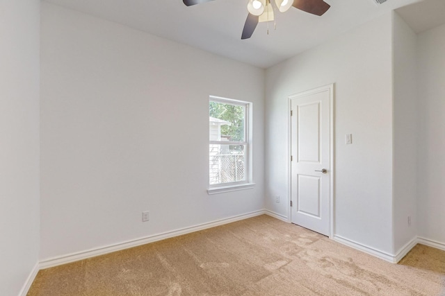 empty room with light carpet and ceiling fan