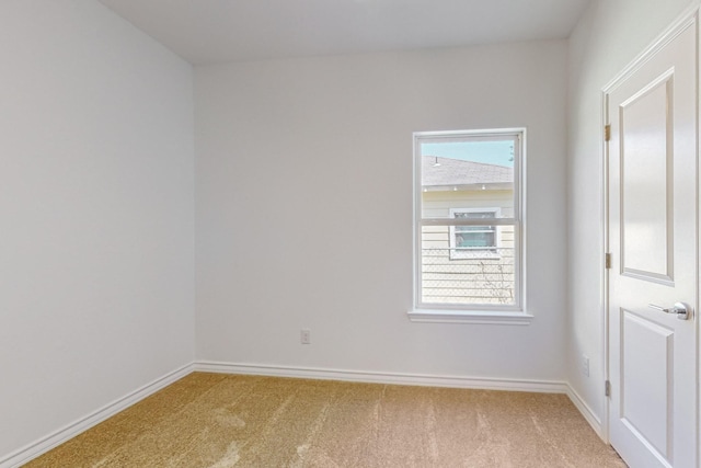 spare room with light colored carpet