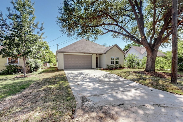 ranch-style home with a front lawn and a garage