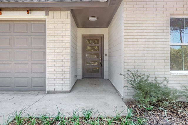 doorway to property featuring a garage