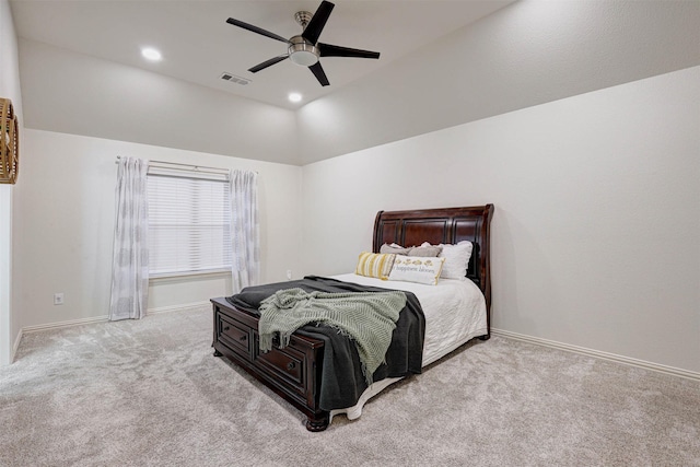 bedroom with lofted ceiling, light colored carpet, and ceiling fan