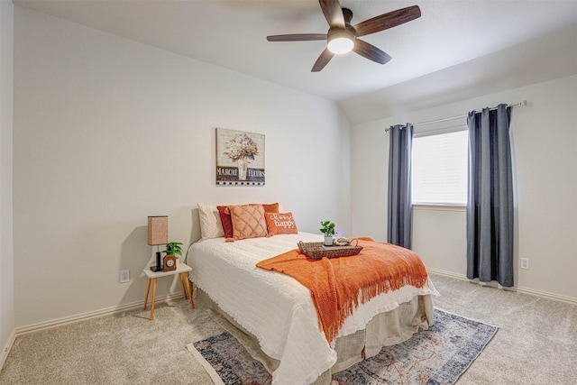 carpeted bedroom featuring lofted ceiling and ceiling fan