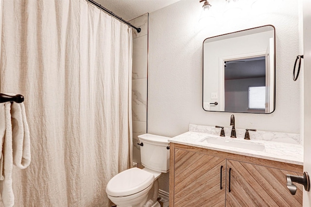 bathroom featuring vanity, toilet, and a shower with shower curtain