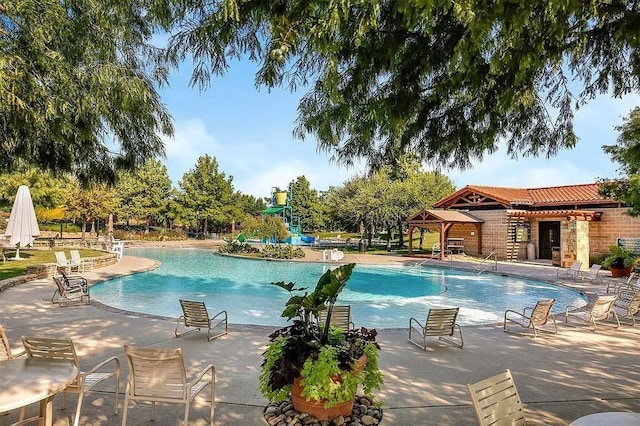 view of swimming pool with a patio