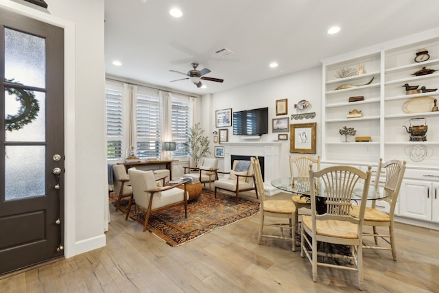 interior space with ceiling fan and light wood-type flooring