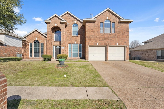 view of front property with central AC unit, a garage, and a front lawn