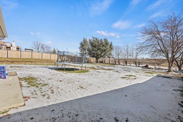 view of yard with a trampoline