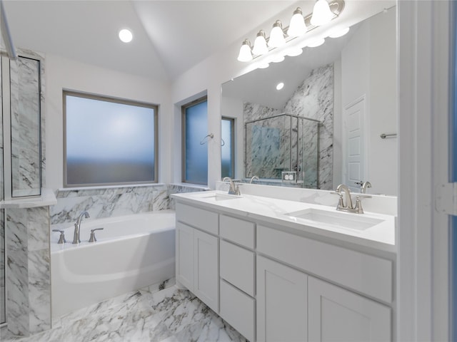 bathroom featuring vanity, separate shower and tub, and vaulted ceiling