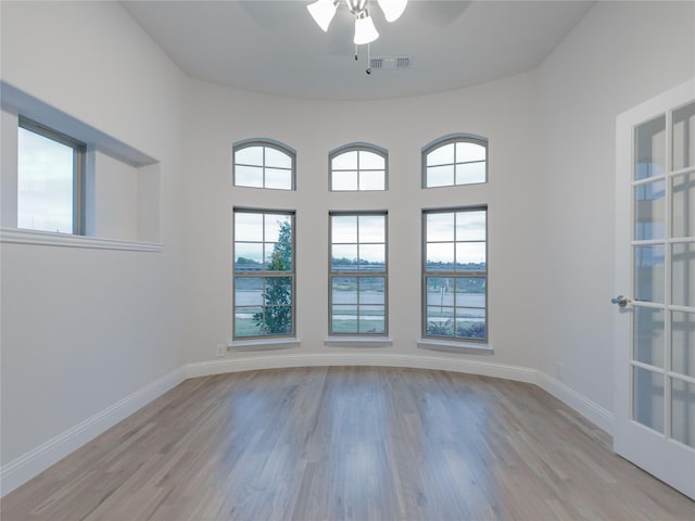 unfurnished room with ceiling fan and light wood-type flooring