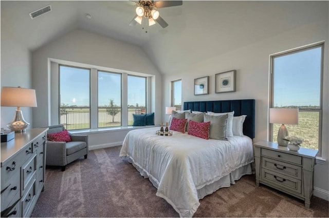 bedroom with vaulted ceiling, ceiling fan, and carpet floors