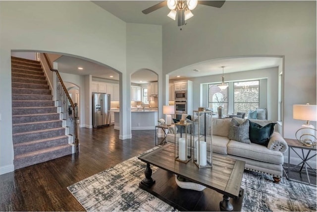 2129 Stone River Blvd, Royse City, TX 75189 - living room with dark hardwood / wood-style flooring, a towering ceiling, and ceiling fan