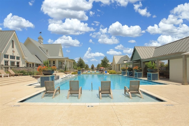 view of swimming pool featuring a patio area