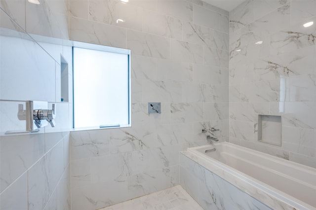 bathroom featuring shower with separate bathtub